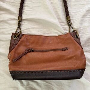 vintage brown and tan leather shoulder bag with bronze hardware